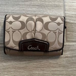 Brown coach trifold wallet